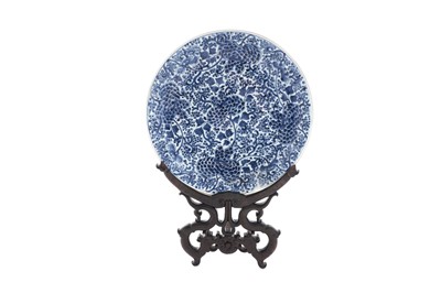 Lot 820 - A Chinese blue and white charger and wood stand