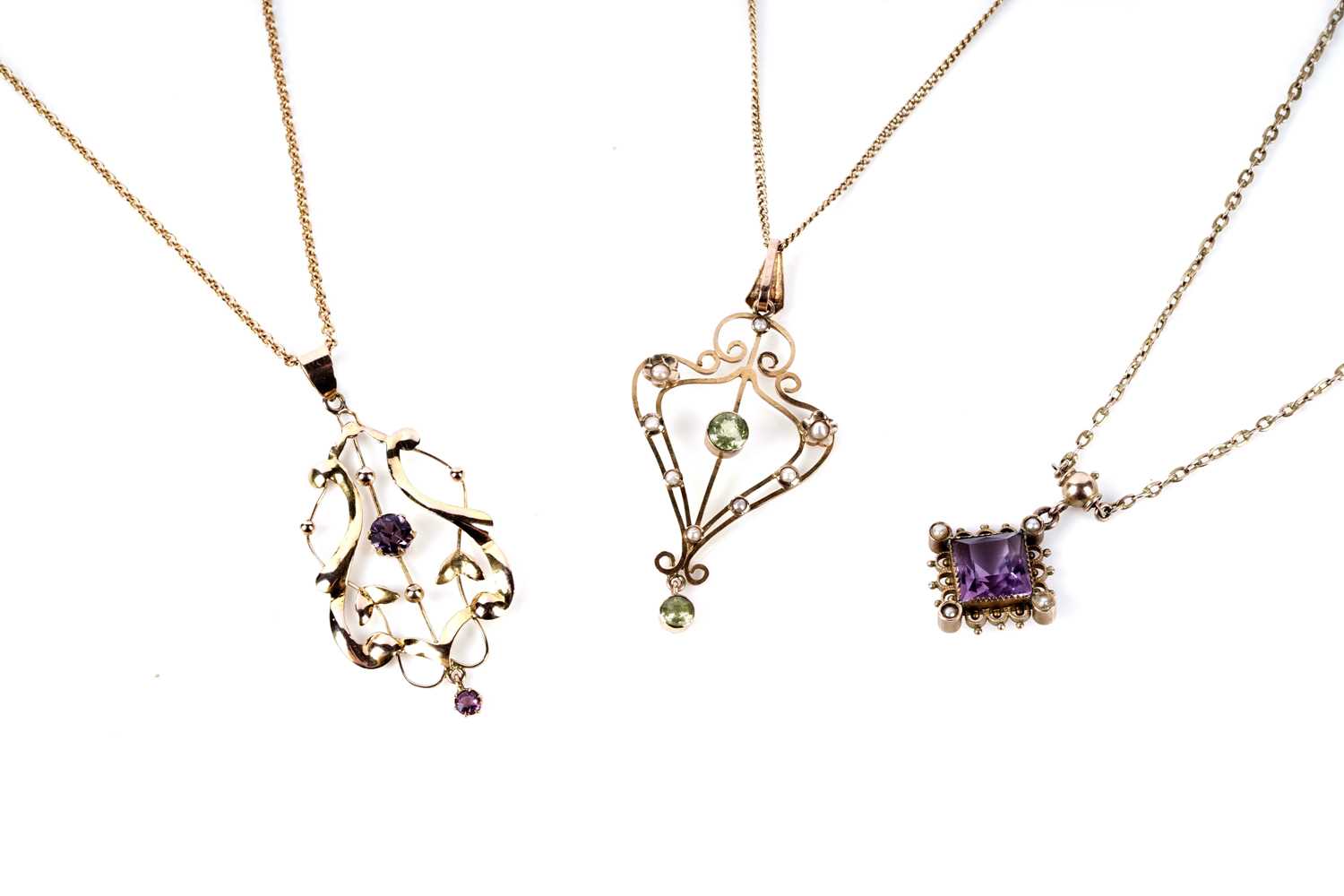 Lot 164 - An Edwardian amethyst and seed pearl pendant necklace; and two others
