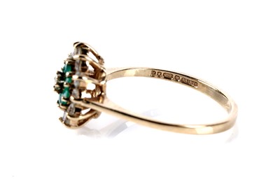 Lot 170 - An emerald and diamond cluster ring