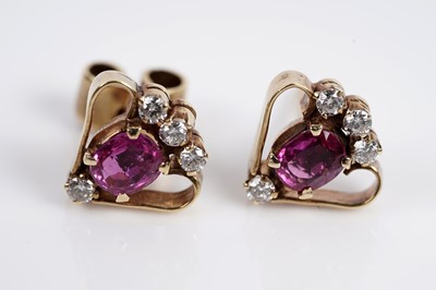 Lot 673 - A pair of ruby and diamond earrings