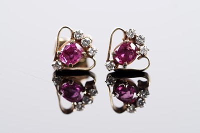 Lot 673 - A pair of ruby and diamond earrings