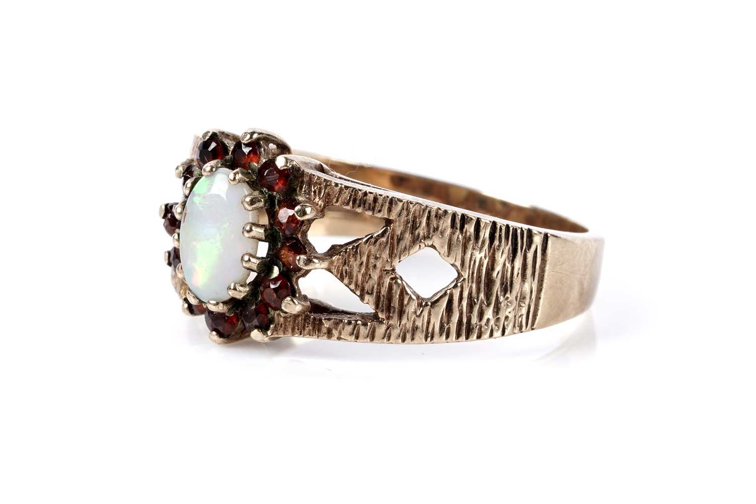 Lot 177 - An opal and garnet cluster ring