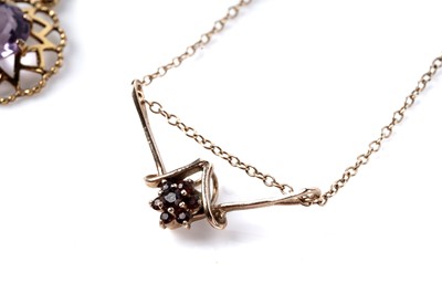 Lot 185 - A garnet flower cluster pendant necklet; and an amethyst pendant