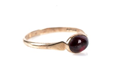 Lot 189 - A garnet cabochon single stone ring; and garnet earrings