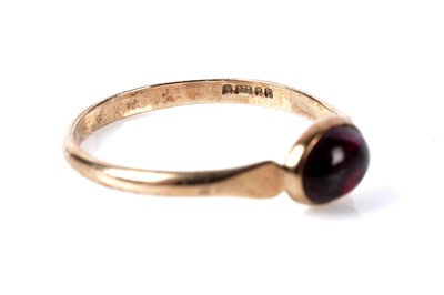 Lot 189 - A garnet cabochon single stone ring; and garnet earrings