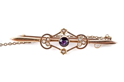 Lot 195 - An Edwardian amethyst and seed pearl bar brooch; and a horse shoe pattern bar brooch