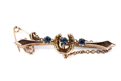Lot 195 - An Edwardian amethyst and seed pearl bar brooch; and a horse shoe pattern bar brooch