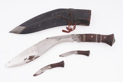 Lot 121 - An early 20th Century Kukri; and a collection of cloth military badges