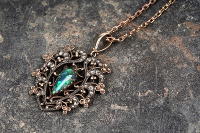 Lot 567 - An Edwardian opal and diamond pendant
