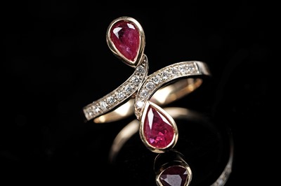 Lot 570 - A ruby and diamond dress ring