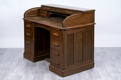 Lot 53 - An early 20th Century oak rolltop desk
