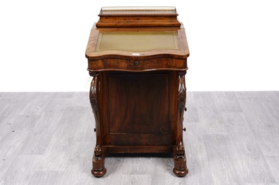 Lot 55 - A Victorian walnut serpentine fronted davenport