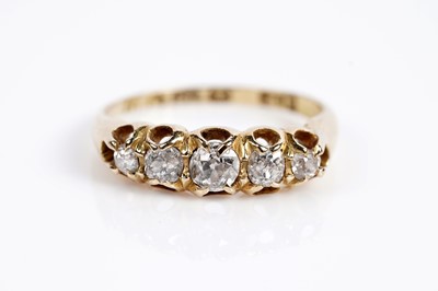 Lot 663 - An Edwardian diamond five stone dress ring