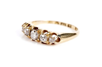 Lot 663 - An Edwardian diamond five stone dress ring
