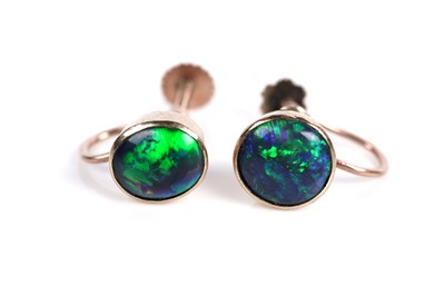 Lot 664 - A pair of black opal cabochon screwback earrings