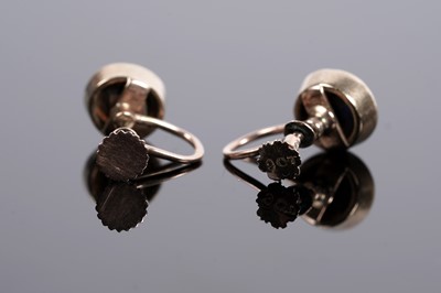Lot 664 - A pair of black opal cabochon screwback earrings