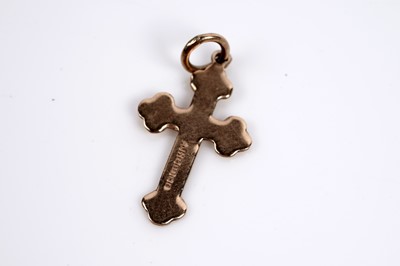 Lot 650 - Two gold crucifix pendants; and a St Christopher pendant