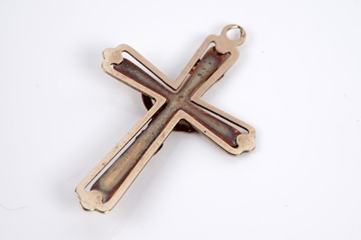 Lot 650 - Two gold crucifix pendants; and a St Christopher pendant