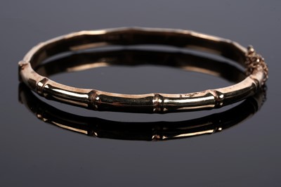 Lot 682 - A 9ct gold bamboo pattern bangle