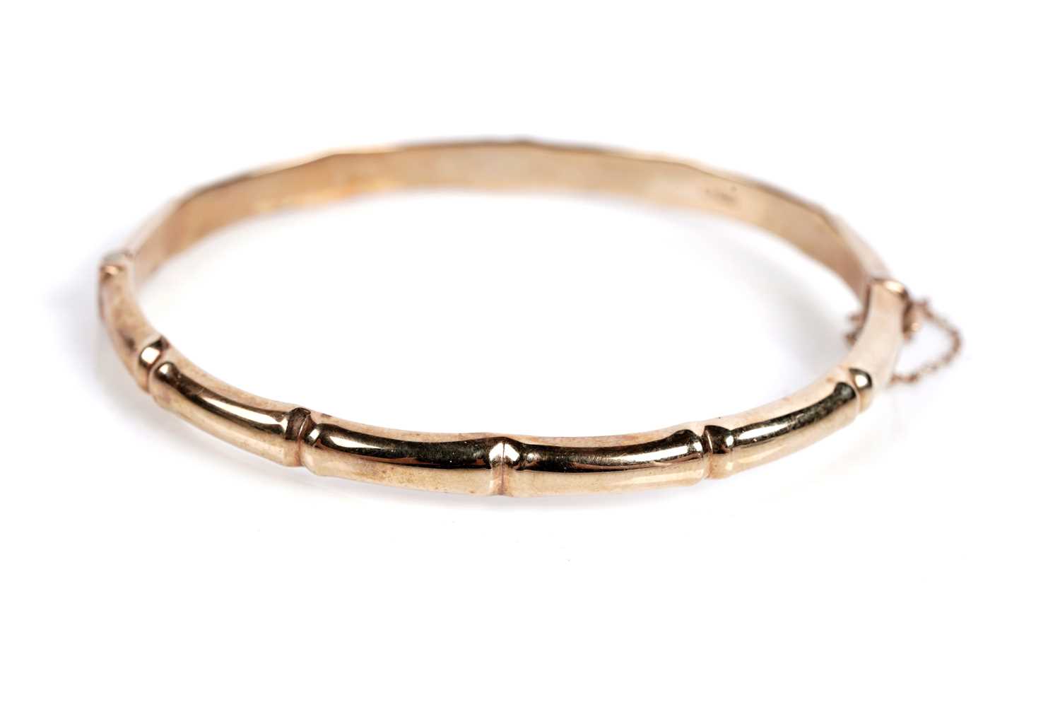 Lot 682 - A 9ct gold bamboo pattern bangle