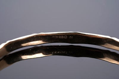 Lot 682 - A 9ct gold bamboo pattern bangle