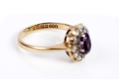 Lot 621 - An amethyst and diamond cluster dress ring
