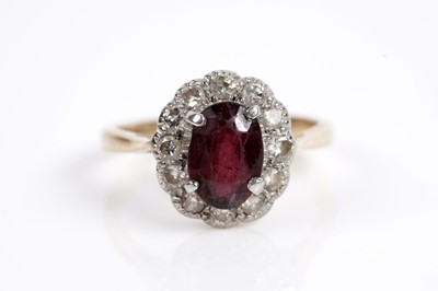 Lot 623 - A garnet and diamond cluster ring; and a ruby and diamond ring