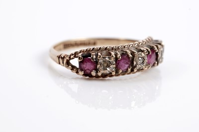 Lot 623 - A garnet and diamond cluster ring; and a ruby and diamond ring