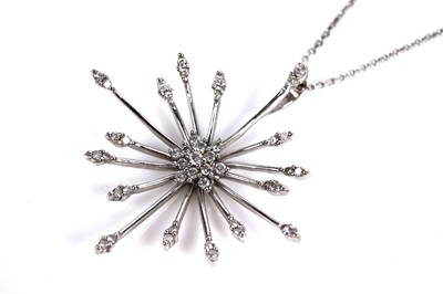 Lot 684 - A diamond cluster sunburst pendant necklace