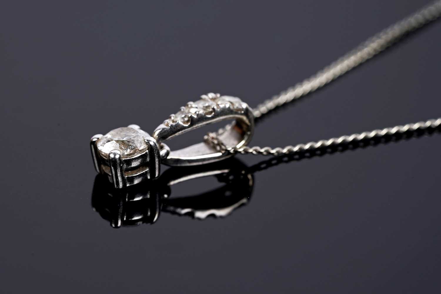 Lot 685 - A diamond drop pendant necklace