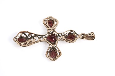Lot 687 - A sapphire and diamond crucifix pendant and a garnet crucifix pendant