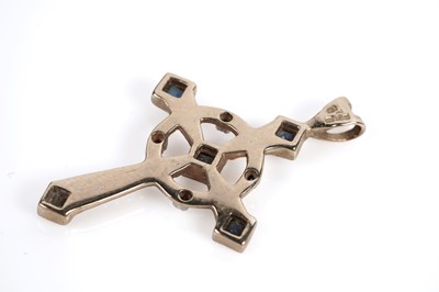 Lot 687 - A sapphire and diamond crucifix pendant and a garnet crucifix pendant