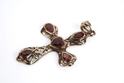 Lot 687 - A sapphire and diamond crucifix pendant and a garnet crucifix pendant