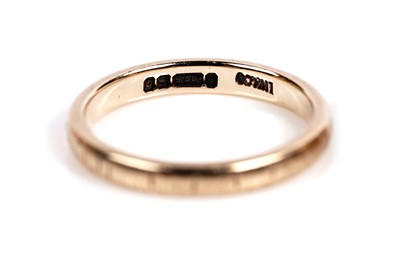 Lot 634 - Two gold wedding bands; and a wishbone band