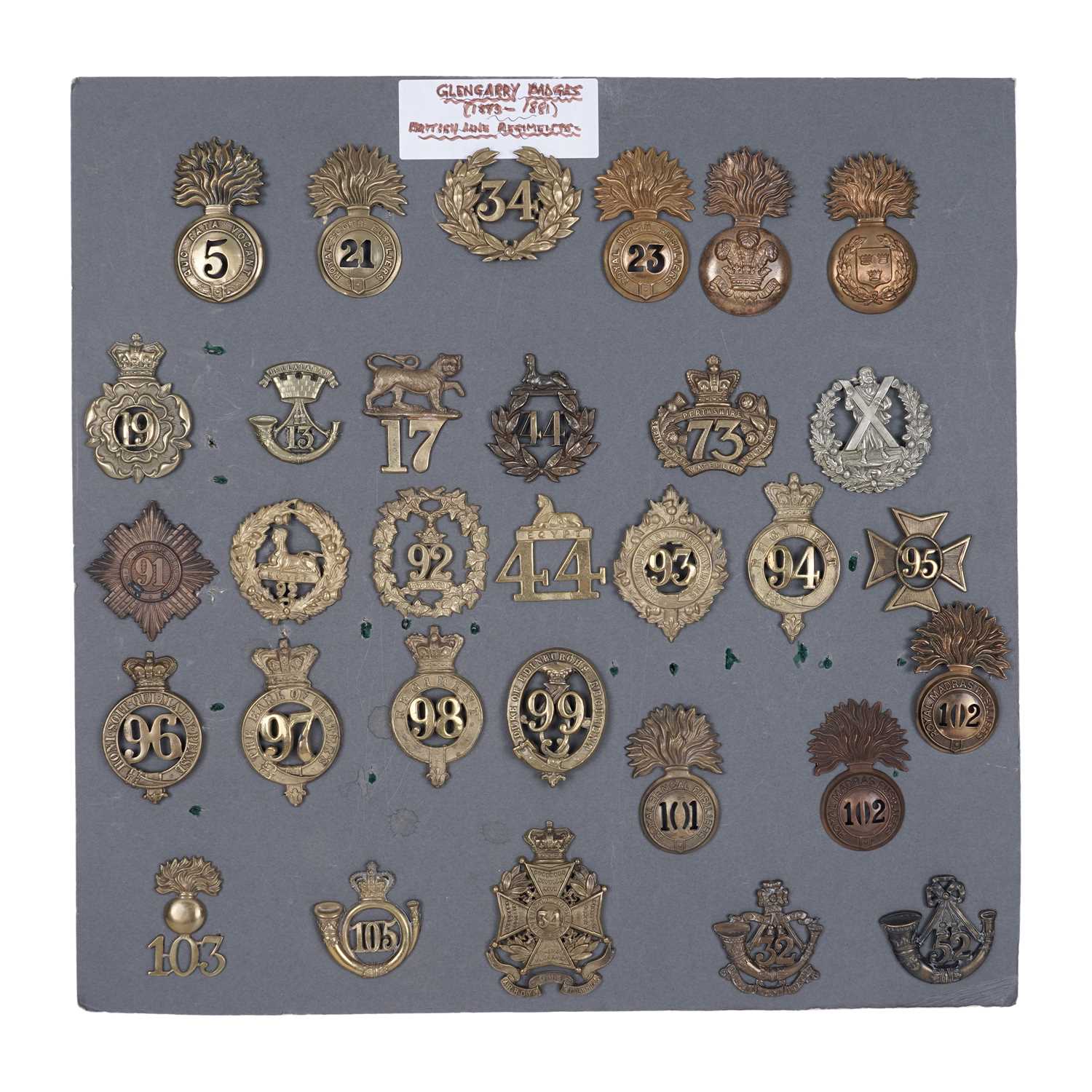Lot 84 - A good display of Victorian brass glengarry badges