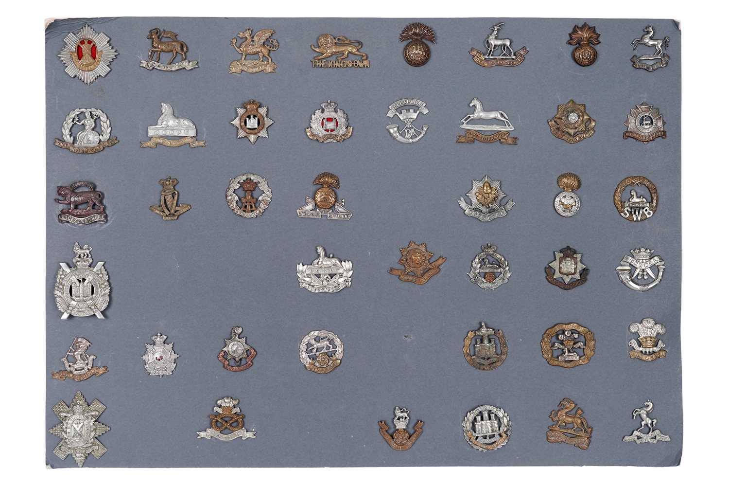 Lot 85 - A display of British regimental cap badges