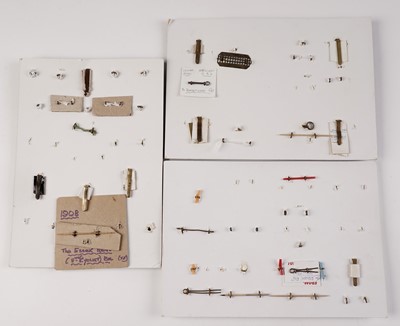 Lot 89 - Three displays of cap badges, collar badges, buttons and titles