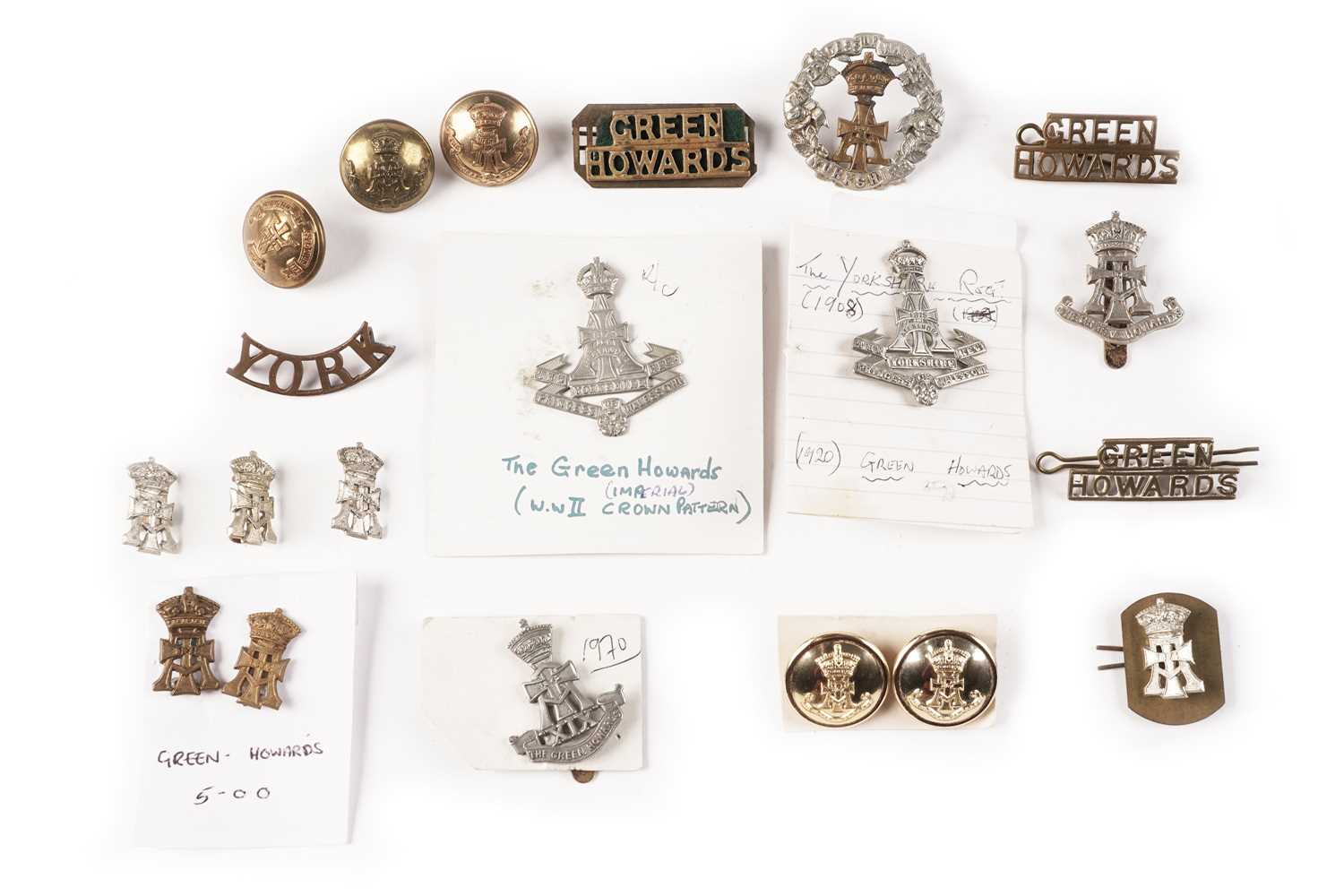 Lot 100 - Yorkshire Regiment (Green Howards) cap badges and other items