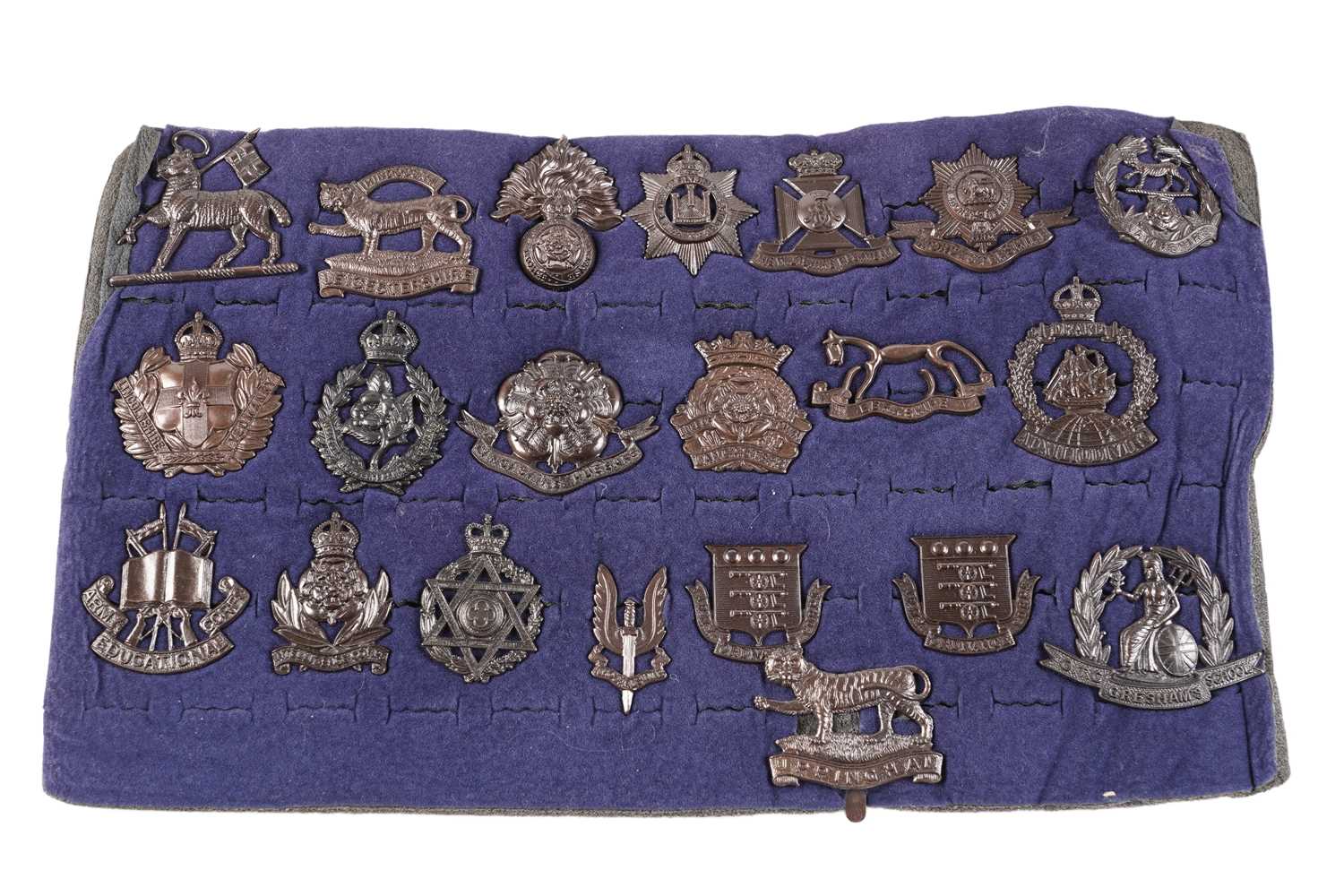 Lot 111 - A display of late pattern British regimental cap badges