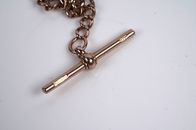 Lot 577 - A 9ct rose gold Albert watch chain; and a yellow gold stud