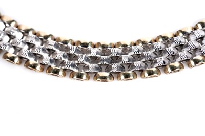 Lot 659 - A 9ct white and yellow gold chain necklace; and bracelet set