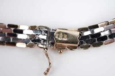 Lot 659 - A 9ct white and yellow gold chain necklace; and bracelet set
