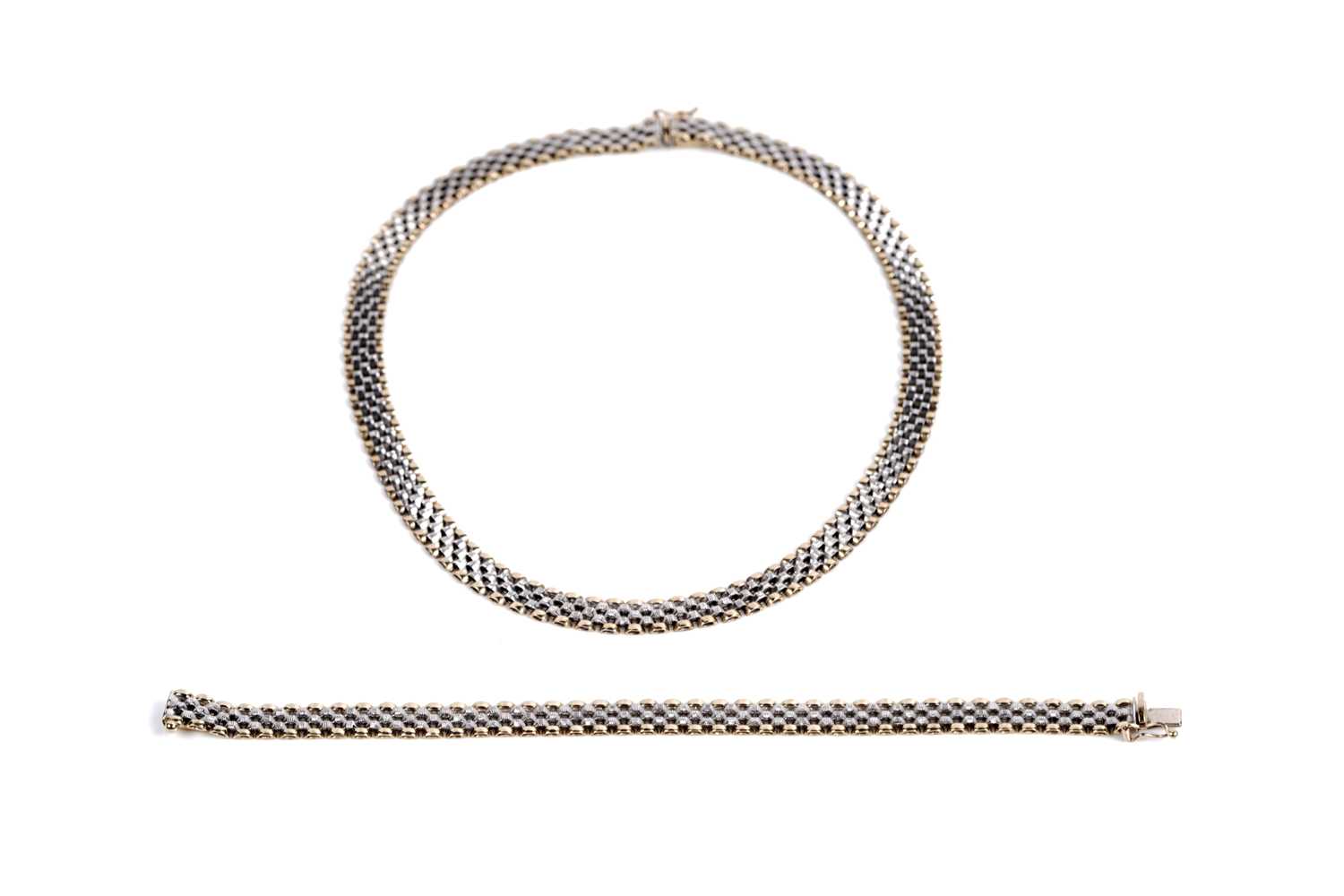 Lot 659 - A 9ct white and yellow gold chain necklace; and bracelet set