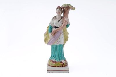 Lot 889 - A Staffordshire pearlware figure of 'Plenty'