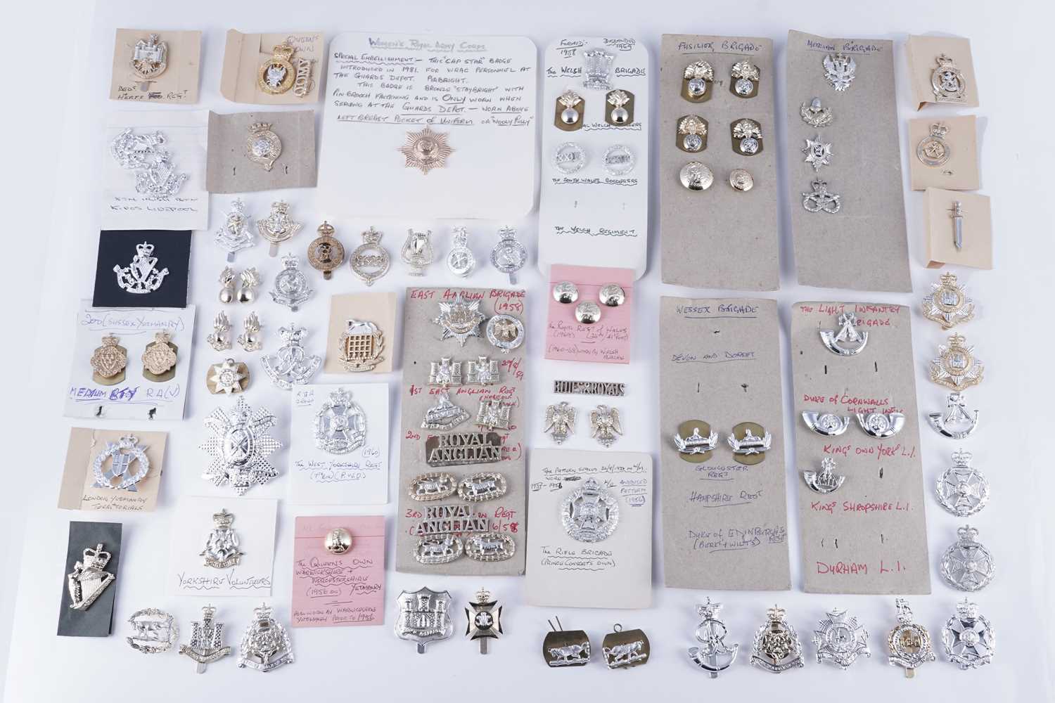 Lot 156 - A selection of British Military regimental collar and cap badges, and other items