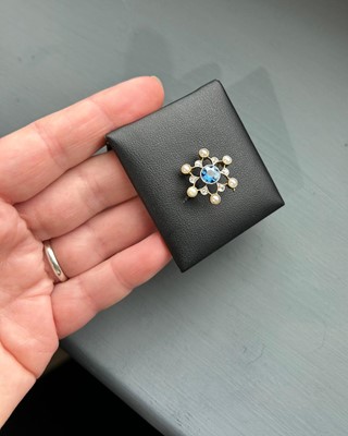 Lot 535 - An antique sapphire, pearl, and diamond brooch