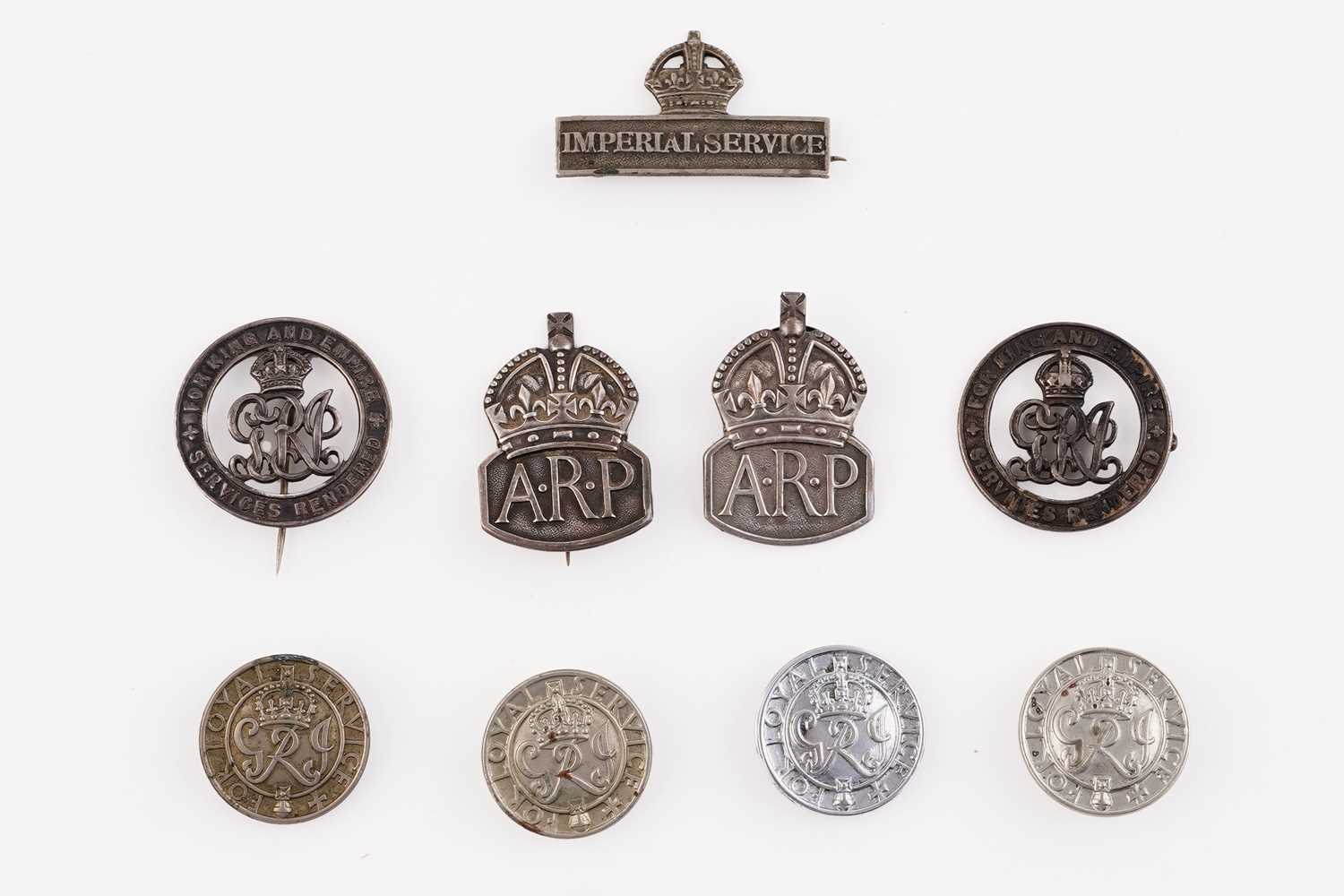 Lot 187 - Two silver Air Raid Patrol lapel badges; and various other badges/buttons