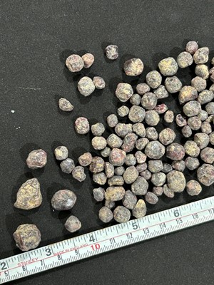 Lot 540 - A collection of rough garnets