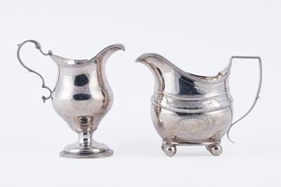 Lot 83 - Two George III silver cream jugs