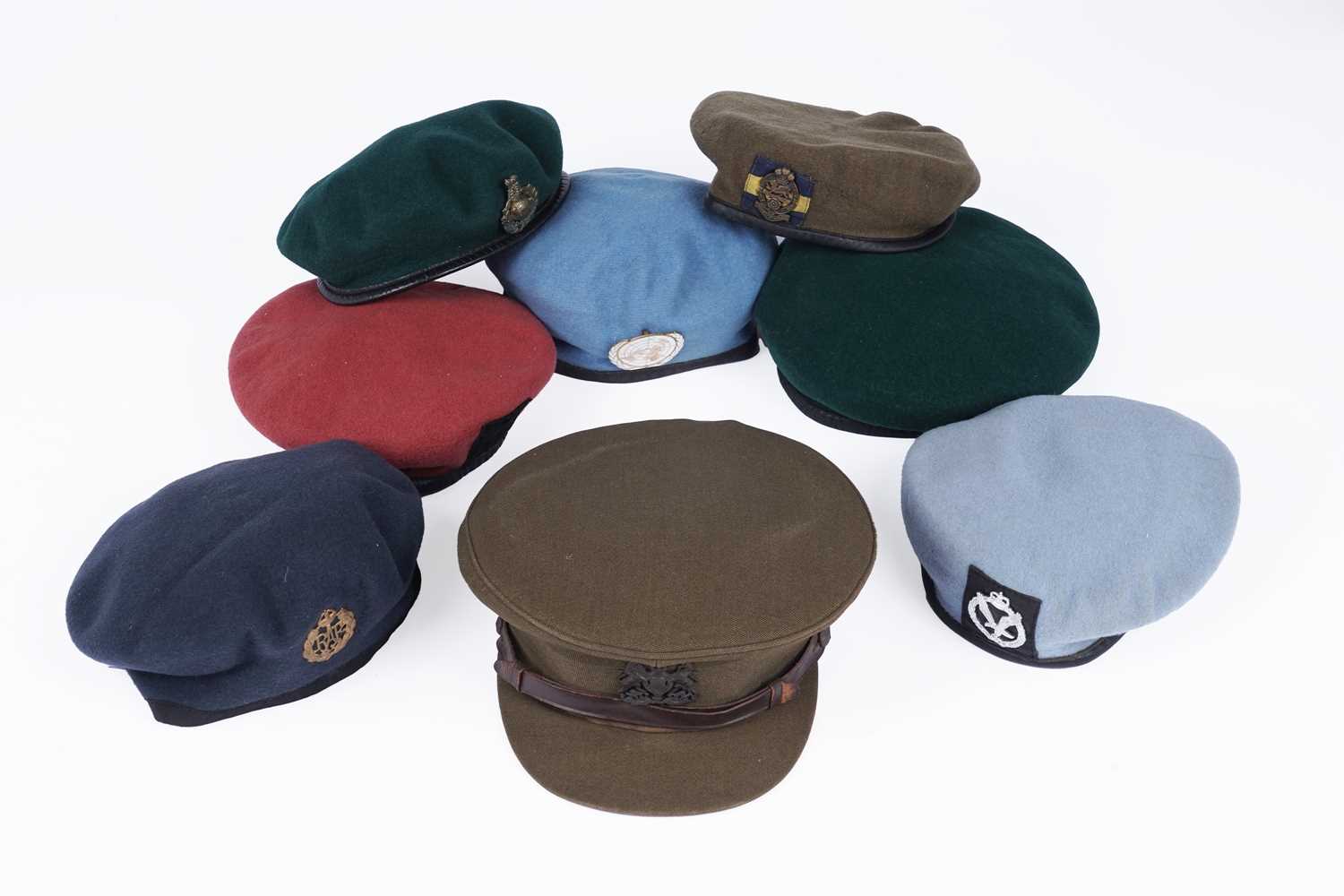 Lot 332 - ﻿﻿A selection of British military berets with badges; and an army officers peaked cap